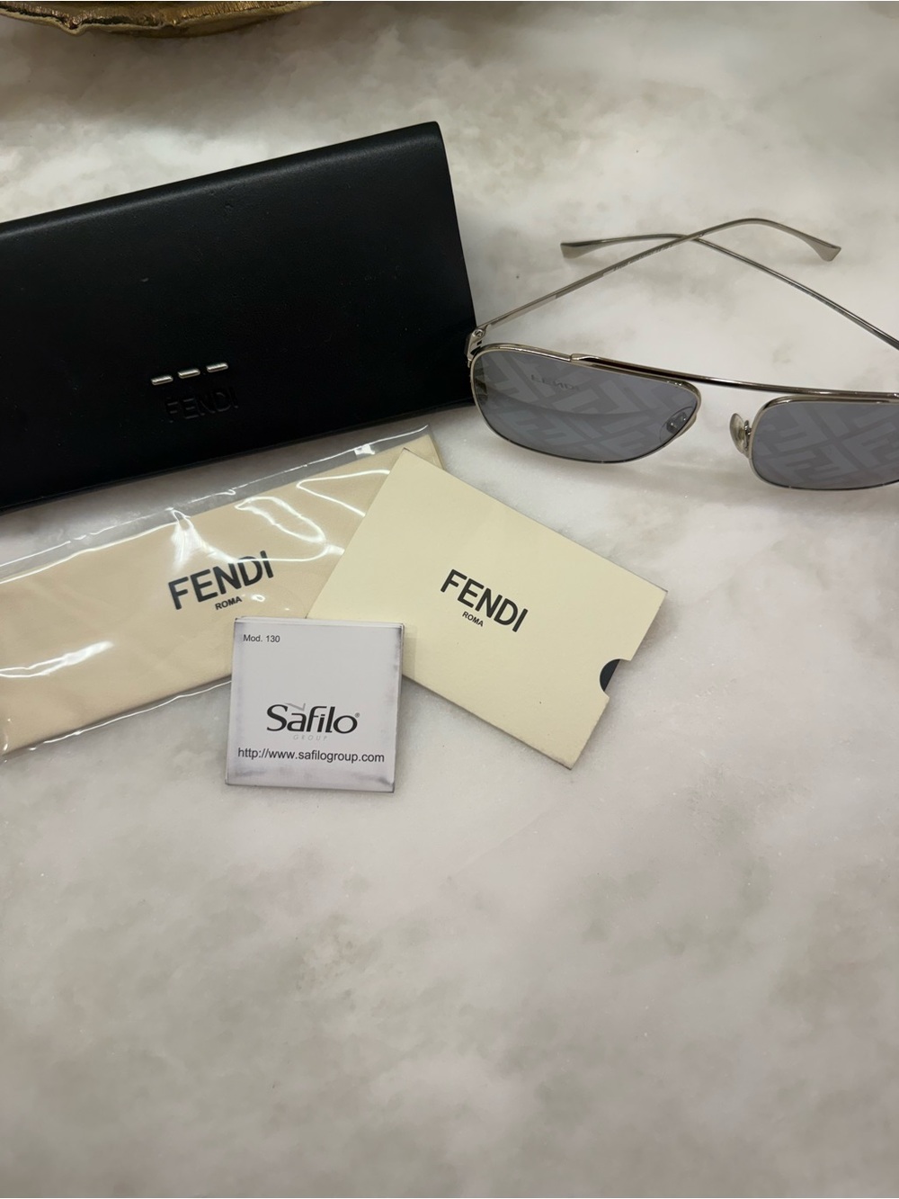 Fendi Silver Rimless Sunglasses with Gray Lenses